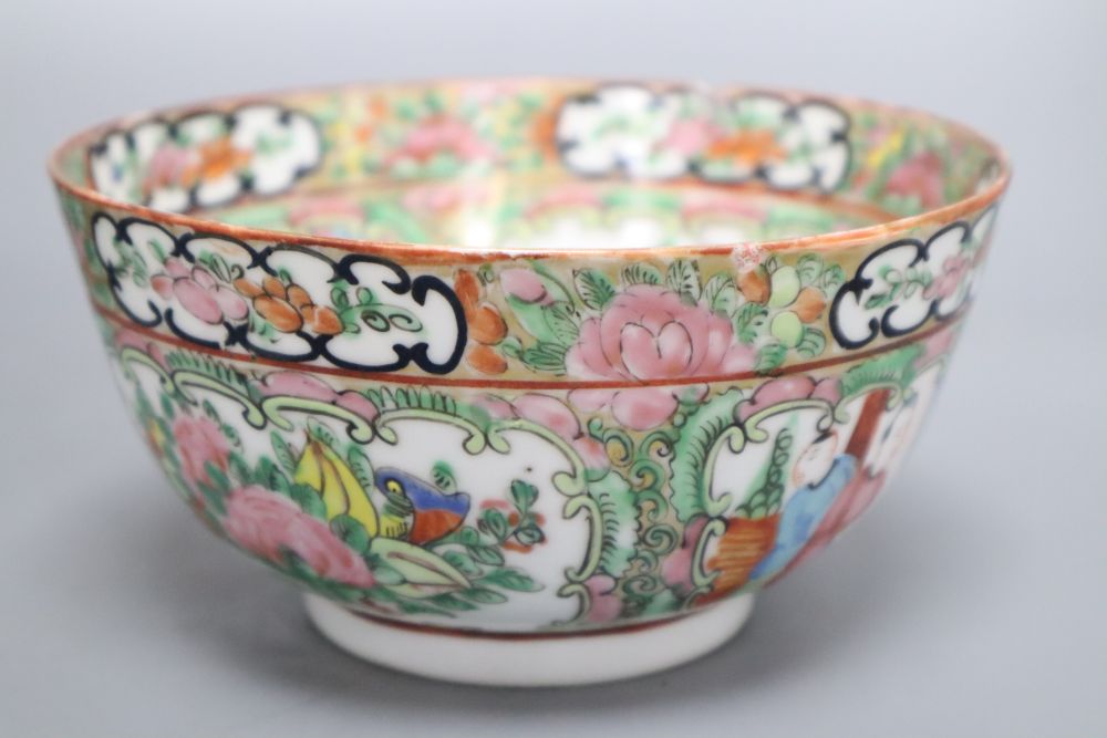 A Chinese blue and white bowl, a famille rose bowl and a famille verte saucer, largest diameter 20cm